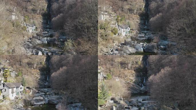 空中无人机在山上的裂缝中拍摄瀑布
