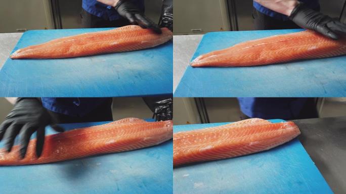 厨师准备鲑鱼的细节照片
