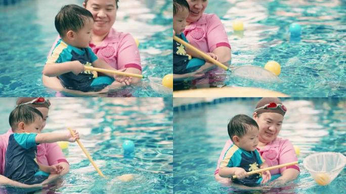 晴天游泳课活跃的小男孩。