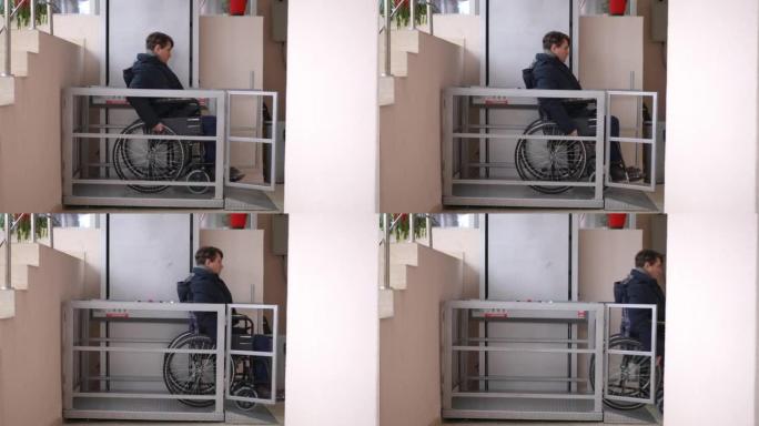 坐轮椅的宽镜头男子离开电梯平台进入大楼。残疾人电梯下集中高加索人滚动移动辅助装置的侧视图。
