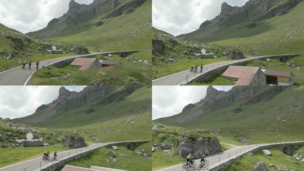 骑自行车者登上山路的鸟瞰图