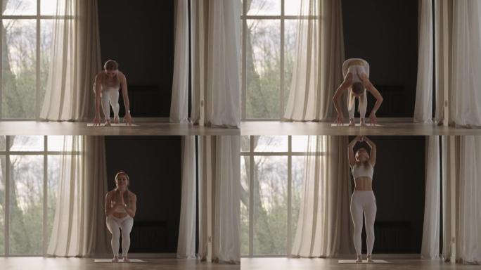 一名穿着白色西装的年轻女子在健身房以慢动作在阳光下训练瑜伽
