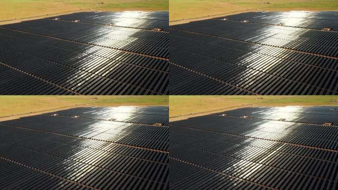 在纪念碑谷附近的亚利桑那州的太阳能农场的无人机空中飞行视图。通过多个太阳能电池板生产绿色能源