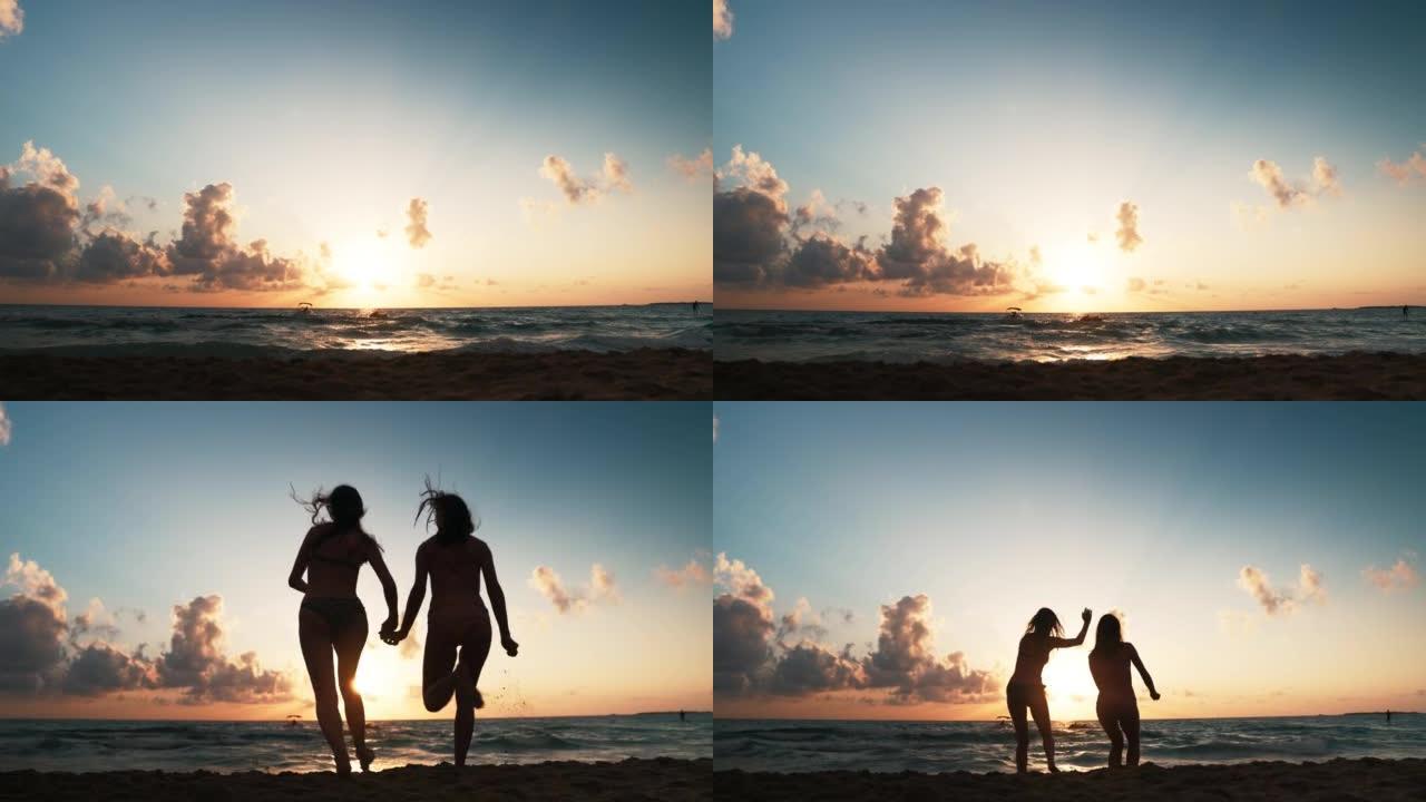 两个女人在海滩上跳跃
