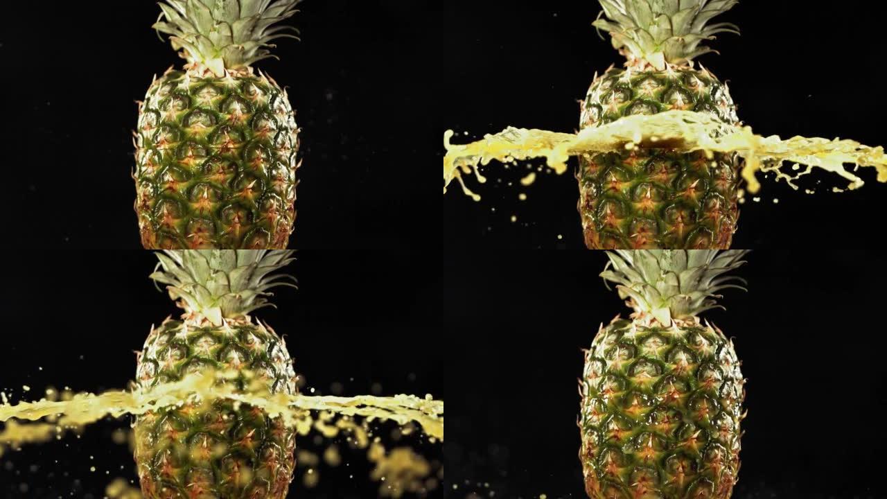黑色背景4K慢动作的新鲜菠萝水果喷出并爆裂果汁