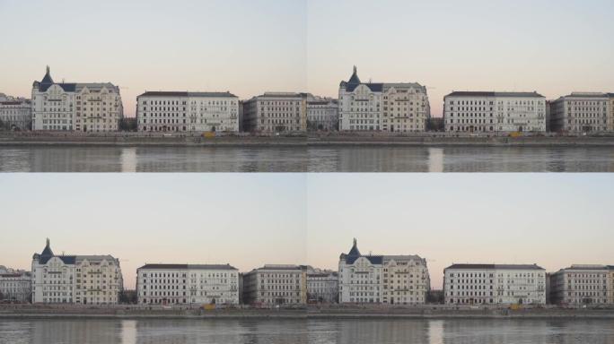 日落时河边建筑物的稳定镜头