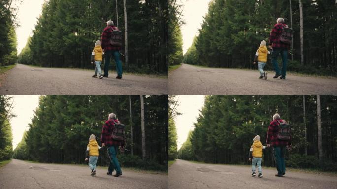 老渔夫和他的小孙子早上在穿越森林的路上行走，爷爷背着棍子