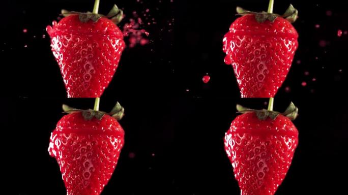 草莓切片掉落并溅到黑色背景上。食物悬浮概念。慢动作