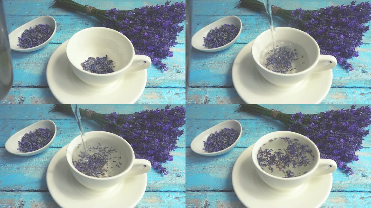 复古木制背景上的淡紫色鲜花茶。茶是在杯子里用热水冲泡的。一股沸水倒入一杯茶中。慢动作。
