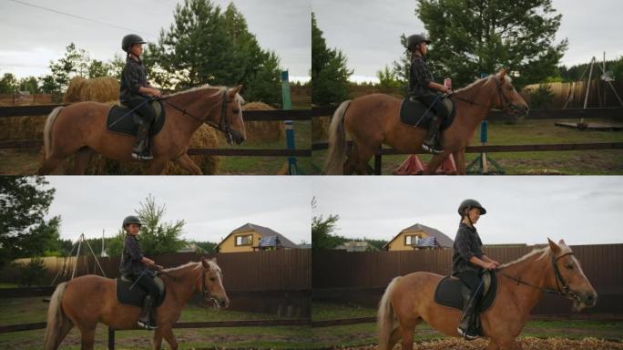 小马俱乐部的马术课，小女孩在围场骑马，在牧场慢慢走