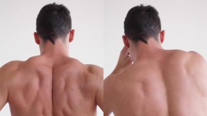 垂直视频运动员患有背痛。白底上的裸背。身体和皮肤护理的概念。颗粒男性皮肤