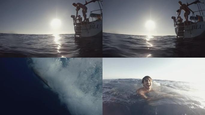 暑假: 朋友在海上从游艇帆船上潜水