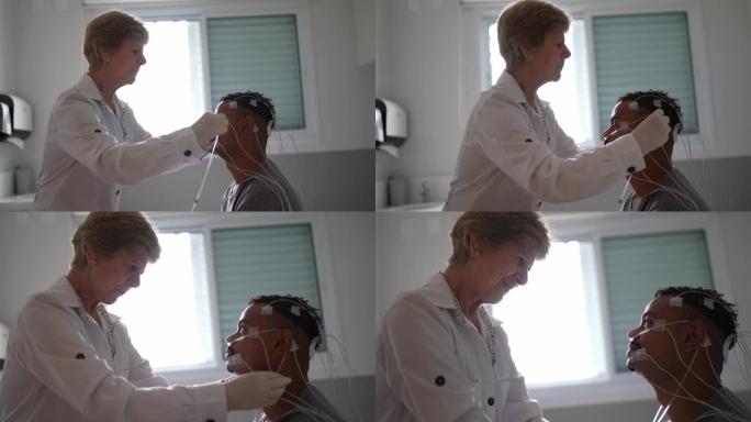 医生将电极放在患者的头部进行体检
