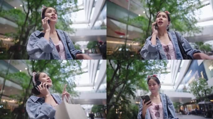 年轻时尚的亚洲女性在购物中心等朋友时打电话，城市生活的5g技术，购物狂周末见面，准时到达但她的朋友迟