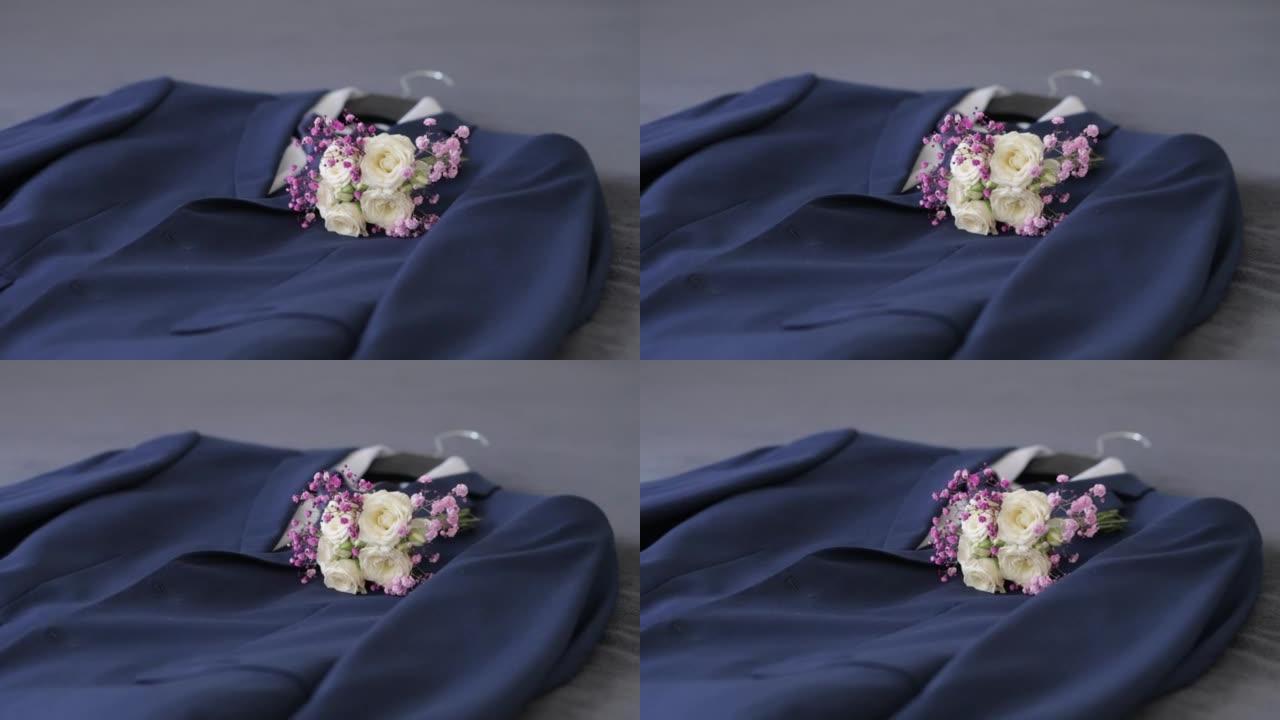 新郎的服装，床上有胸花和婚礼花束