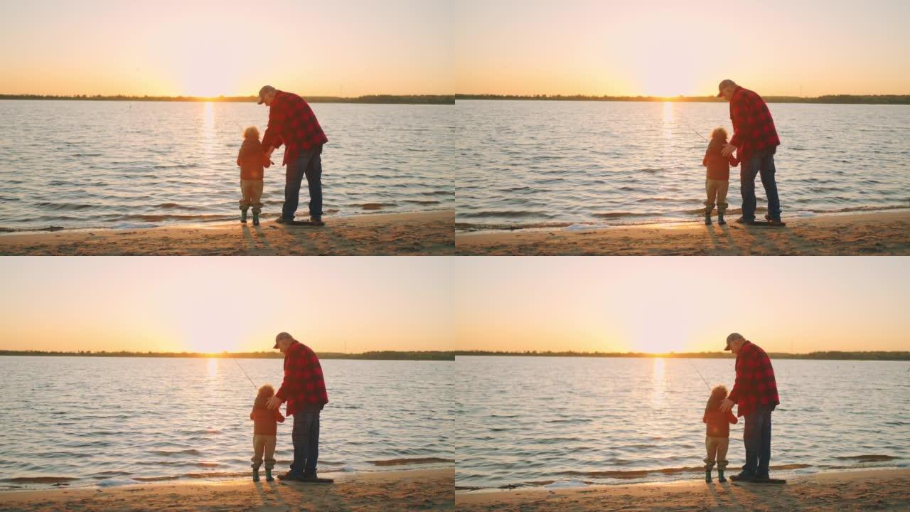 爷爷在教他的小孙子用鱼竿抓鱼，老人和蹒跚学步的孩子站在沙滩上