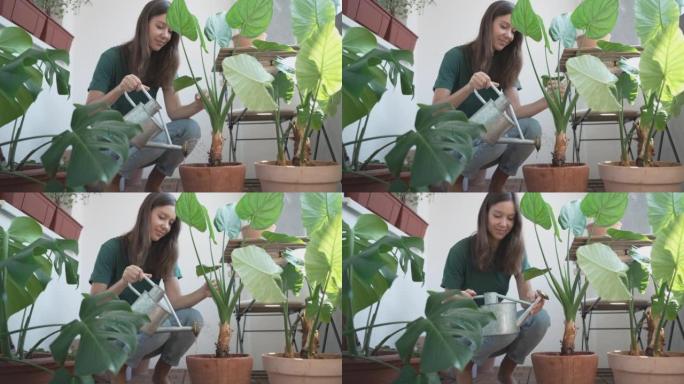 年轻女子倾向于在公寓外种植植物