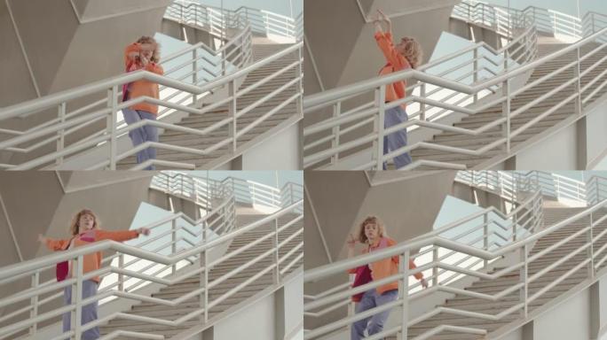 Y2K女孩在户外楼梯上跳舞当代自由泳