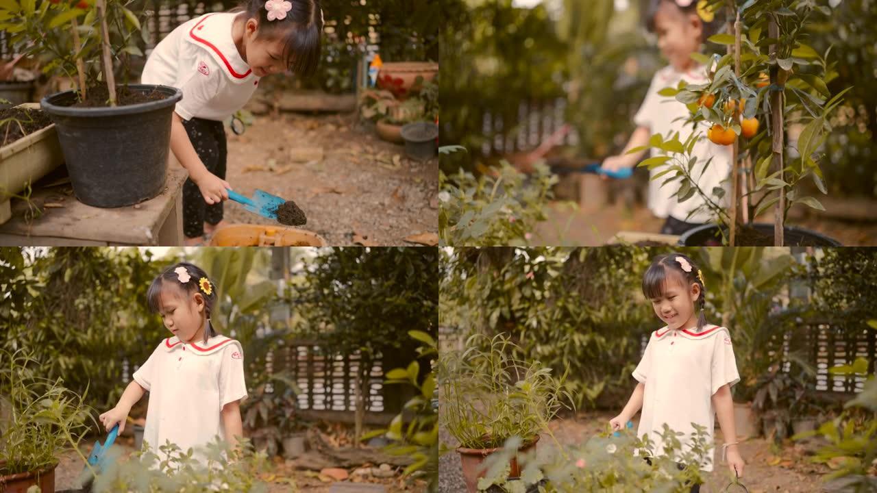 亚洲女孩通过给植物浇水来照顾花盆中的植物