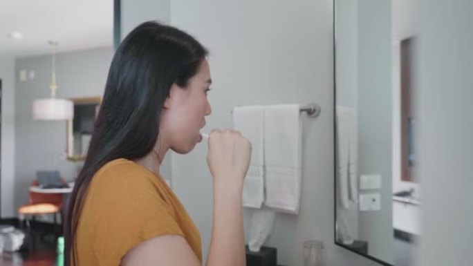 Southeast Asian woman brush teeth