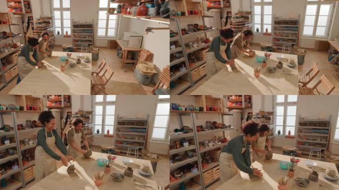 CS女学生在陶艺工作室学习楔入粘土