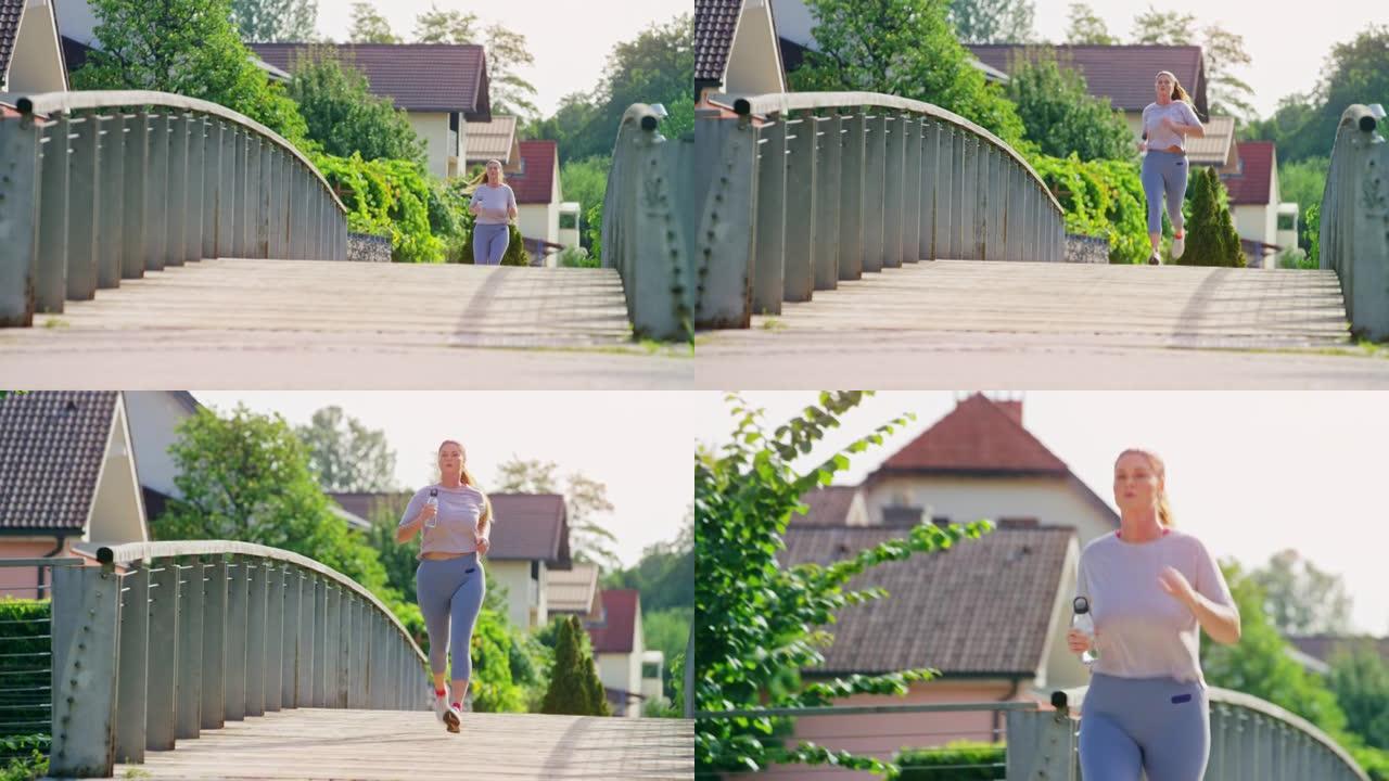 长着马尾的女人在城市的一座桥上奔跑