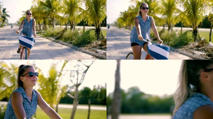 墨西哥海滩附近骑自行车的年轻女子