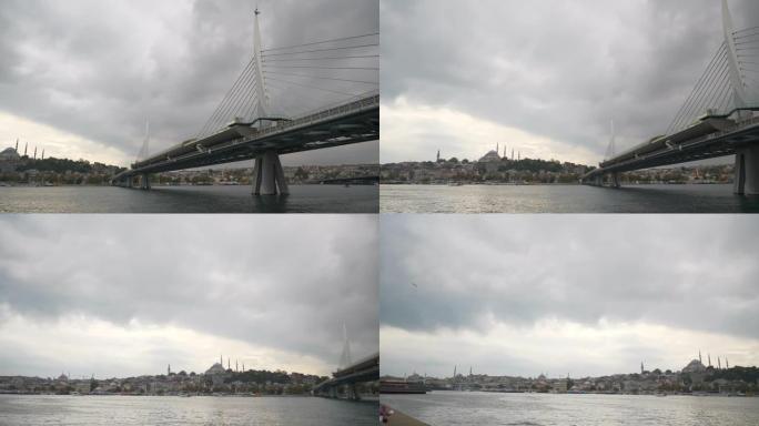 多云的一天伊斯坦布尔市著名的海湾地铁大桥慢动作全景4k土耳其