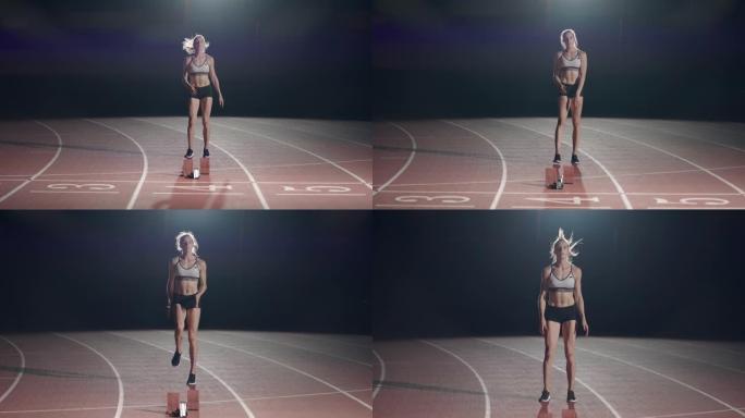女运动员在比赛前在跑道上热身。慢动作。田径比赛的女跑步者在比赛前蹲在起跑区。