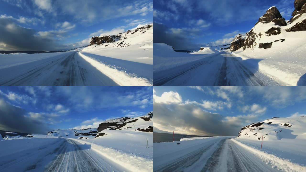 挪威北部峡湾在雪地里行驶的POV汽车