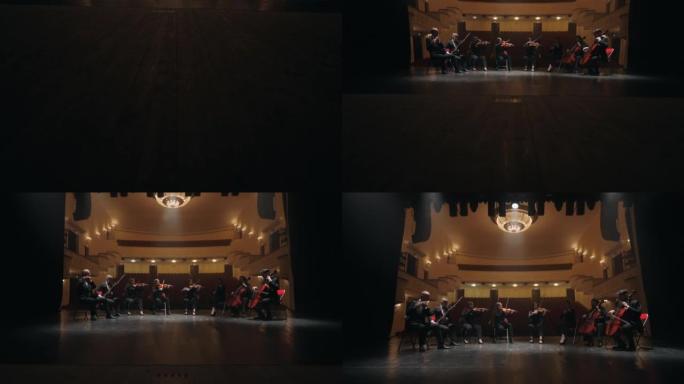 大提琴，小提琴，低音管和长笛乐队在歌剧院现场演奏
