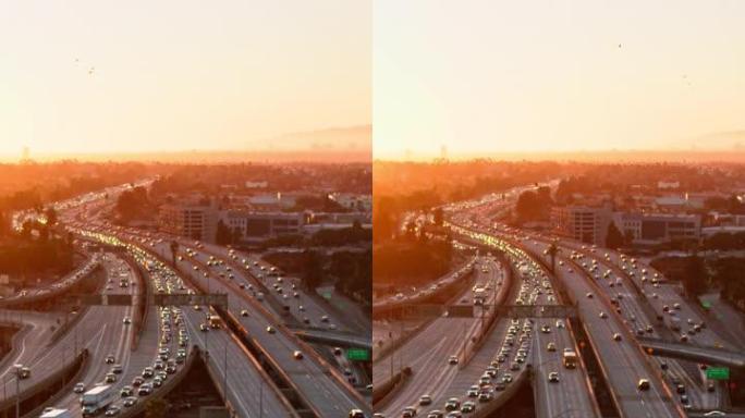 日落时加利福尼亚州洛杉矶10号州际公路和110号高速公路上的交通鸟瞰图