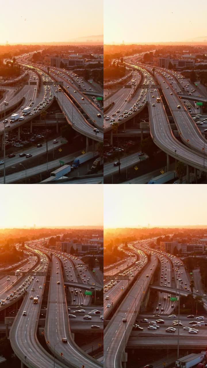 日落时加利福尼亚州洛杉矶10号州际公路和110号高速公路上的交通鸟瞰图