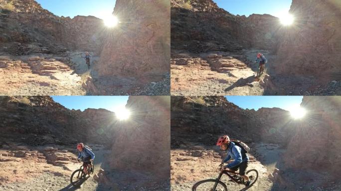 男性山地自行车手探索沙漠峡谷