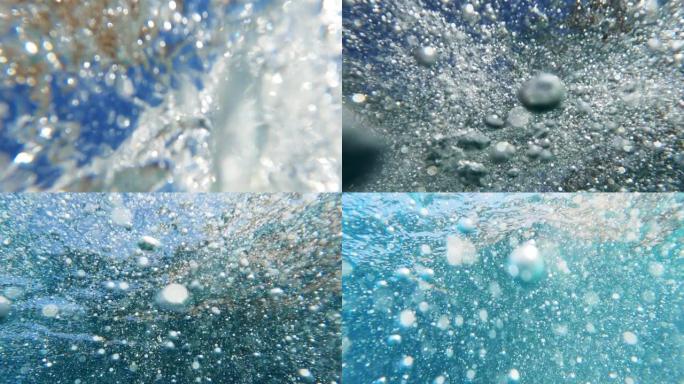 用可穿戴相机潜入大海。飞溅的水和气泡