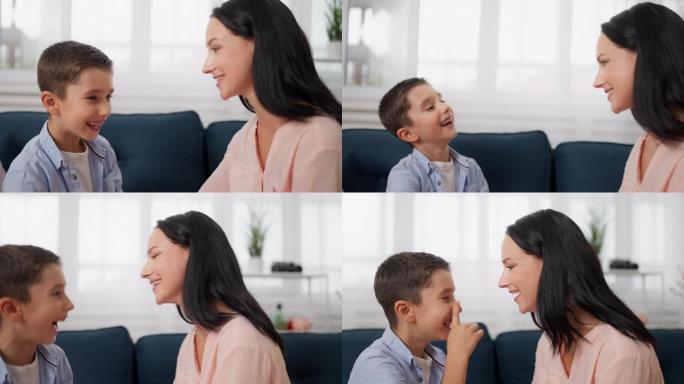男孩和母亲在沙发上笑的特写镜头，母子关系快乐