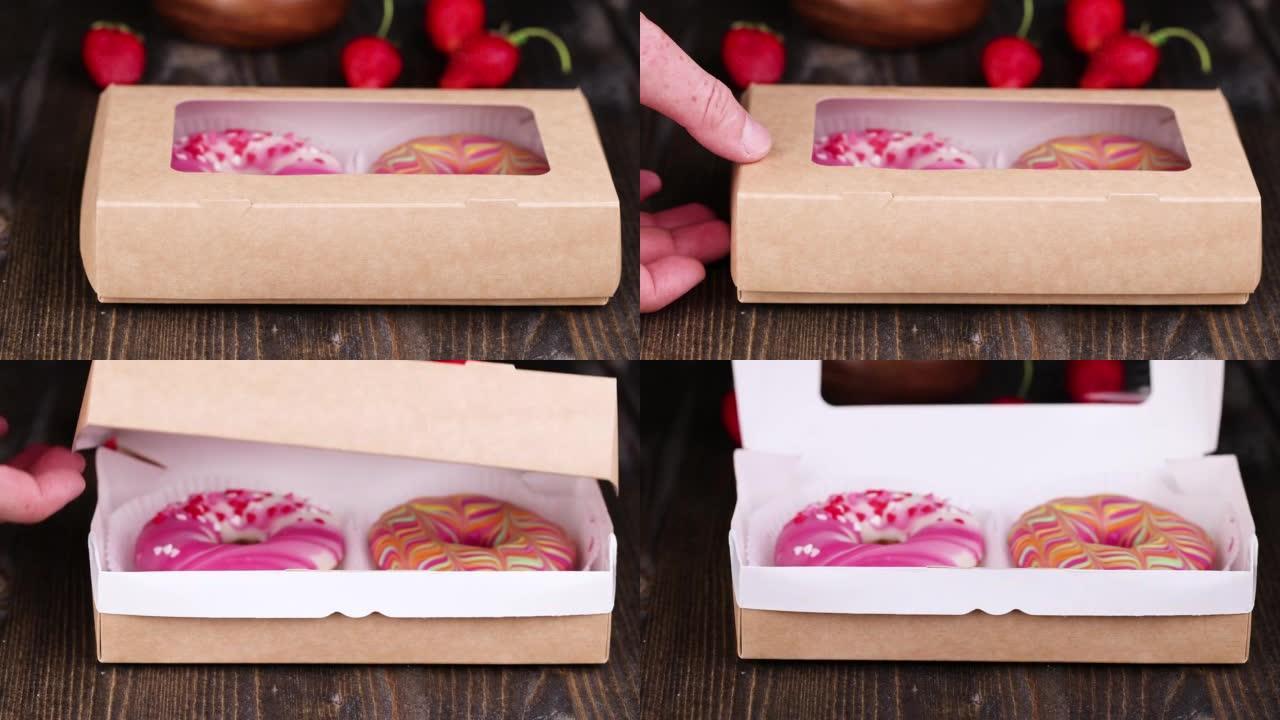 打开一个装有釉面甜甜圈和浆果馅的盒子