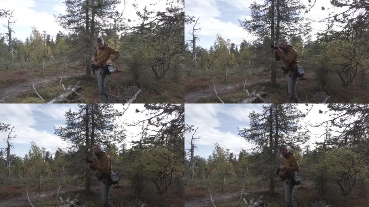 摄影师在森林中拍摄一对山地车手的全景