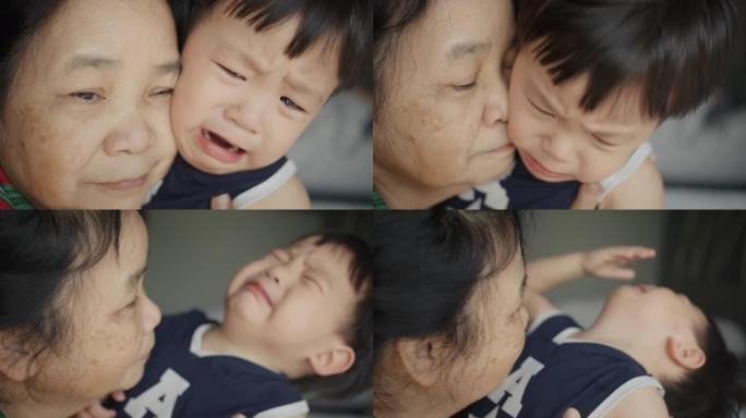 祖母含泪拥抱学龄前男孩。