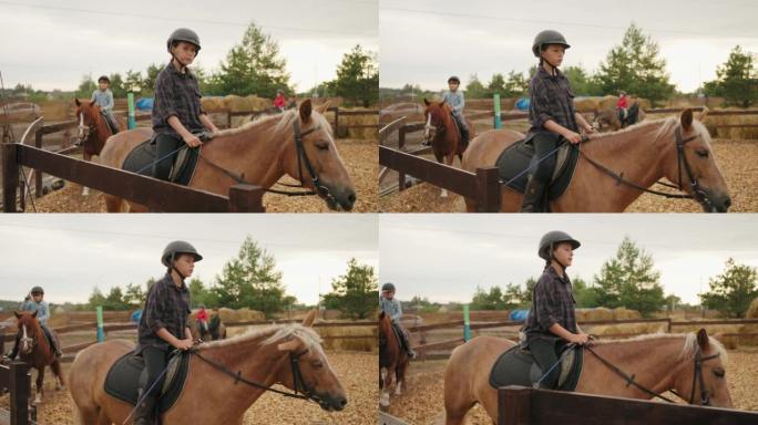 小马俱乐部的集体训练、围场骑马的儿童、体育活动和海马疗法
