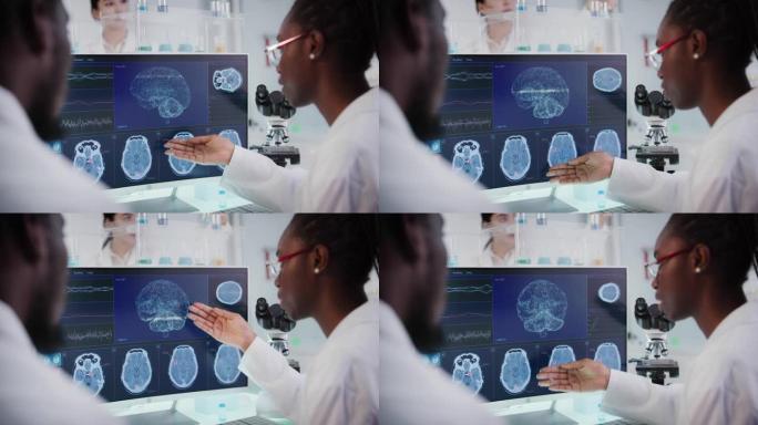 实验室设备和计算机。屏幕上的脑电波研究。非洲族裔科学家讨论