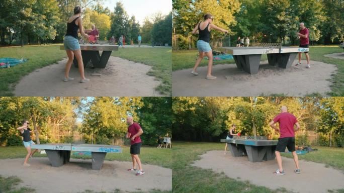 夏天晚上，男人和女人在公园打乒乓球