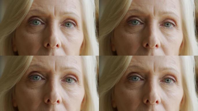 老妇人的脸和眼睛。老妇人脸上的大皱纹。脸部特写