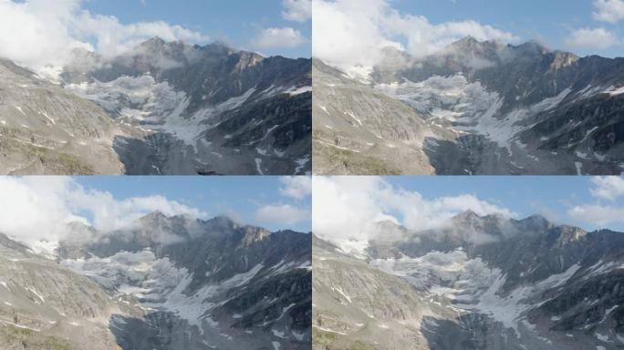 从上面看雄伟的阿尔卑斯山。冰山和雪覆盖的尖峰