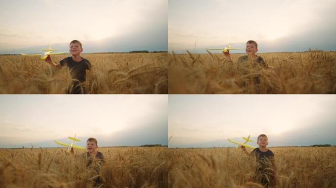 夏季，无忧无虑的高加索男孩在金色的麦田上奔跑，运动中的肖像