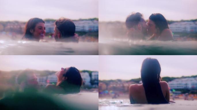 浪漫的异性恋夫妇一起在海里游泳。互相拥抱和旋转
