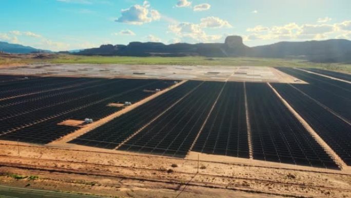 在纪念碑谷附近的亚利桑那州的太阳能农场的无人机空中飞行视图。绿色能源生产