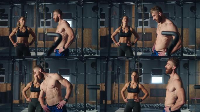 男性和女性健美运动员在健身房，躯干的运动男子和美丽的运动的数字的女士
