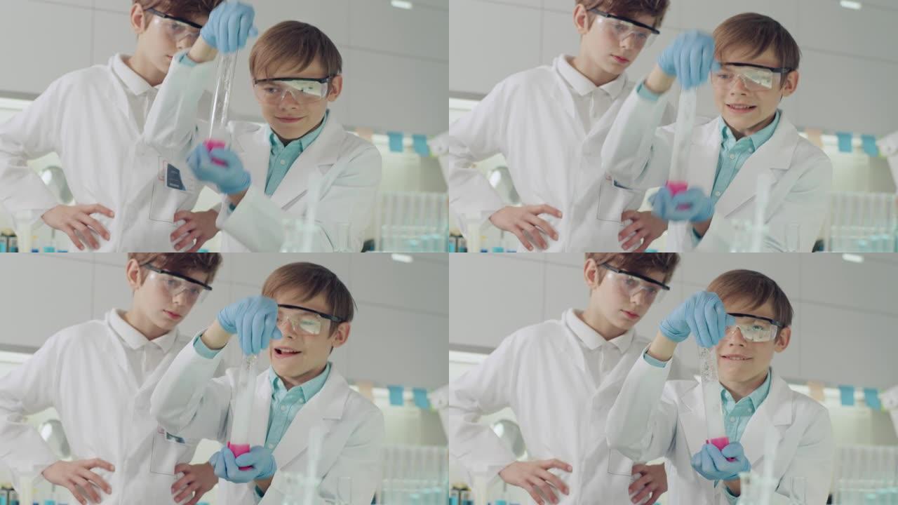 孩子们进行科学实验。实验室内部，浇注多色液体