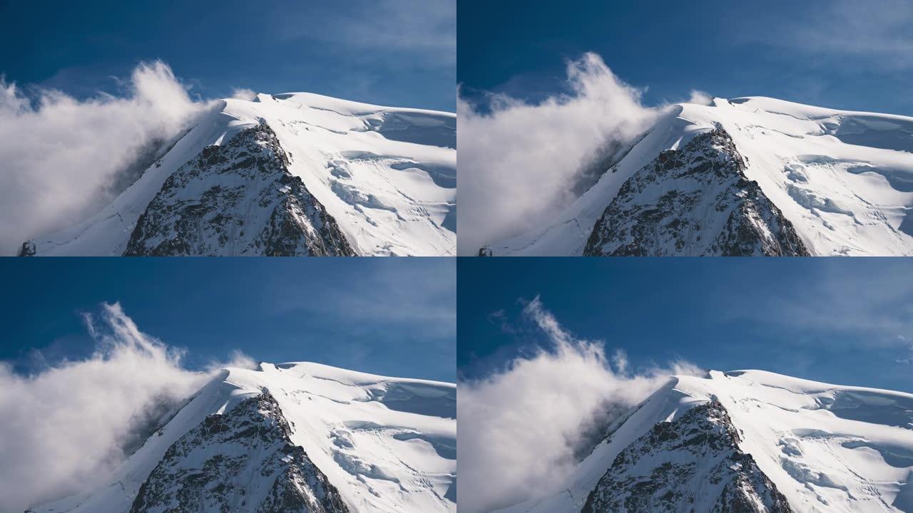 从上面看雄伟的阿尔卑斯山。冰山和雪覆盖的尖峰